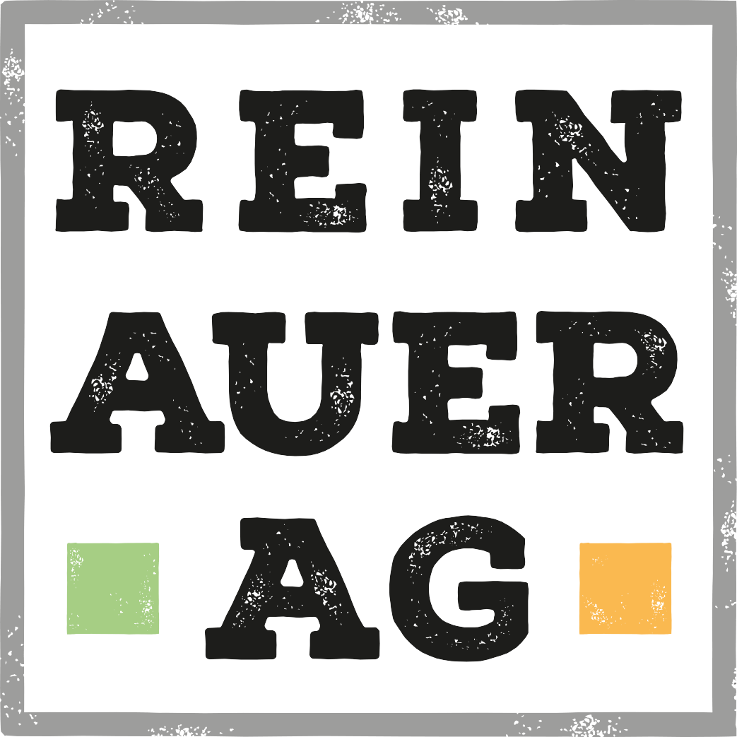 Logo der REINAUER|AG, quadratisch, grau eingerahmt, Schrift schwarz, REIN,darunter AUER, darunter AG